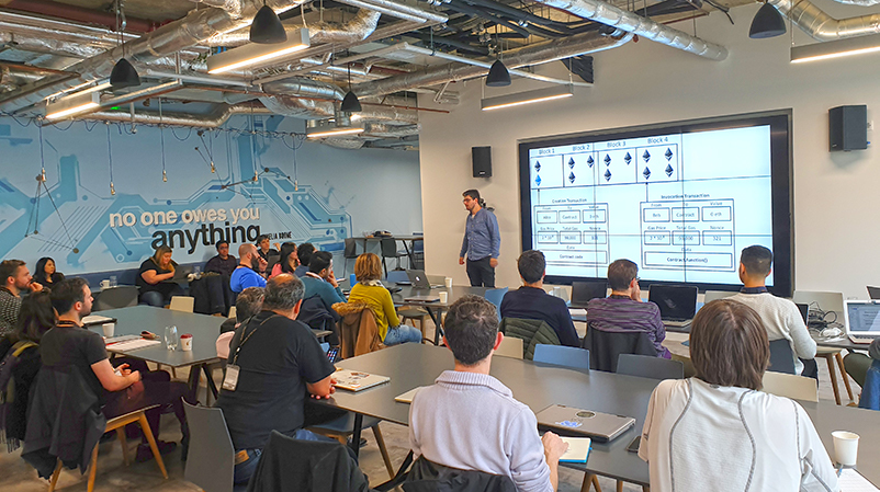 KCL’s Patrick McCorry teaches a cohort in a bootcamp sponsored by Blockchain.com KCL’s Patrick McCorry teaches a cohort in a bootcamp sponsored by Blockchain.com